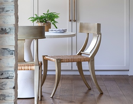 Breakfast nook with custom cabinetry and exposed white washed brick in Houston, TX