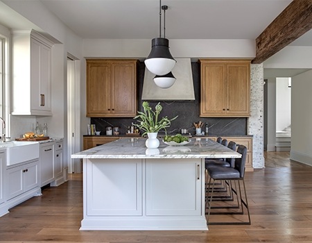 Chef's kitchen detail with Wolf stove and custom venthood in Houston, TX