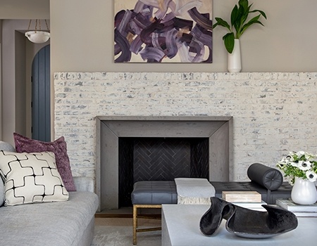 White Washed brick fireplace in a modern designed livingroom in Houston, TX
