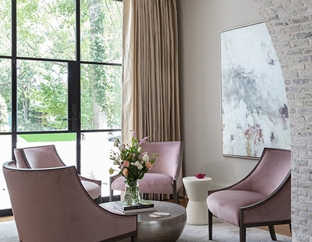 Sitting parlor close-up with arch detail with exposed white washed brick black steel windows in Houston, TX