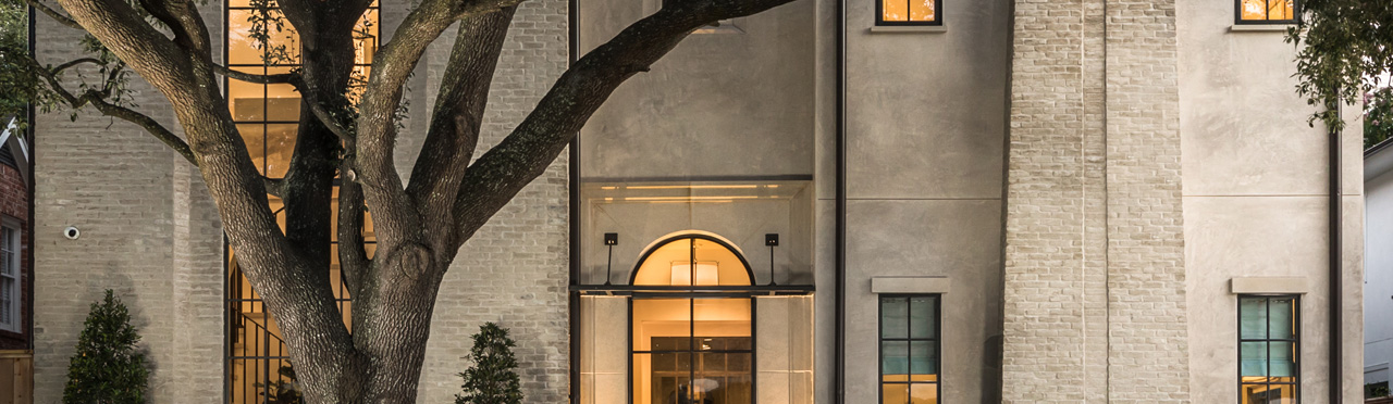 Street view of a custom Home With Iron Windows with curb appeal in Houston, TX.