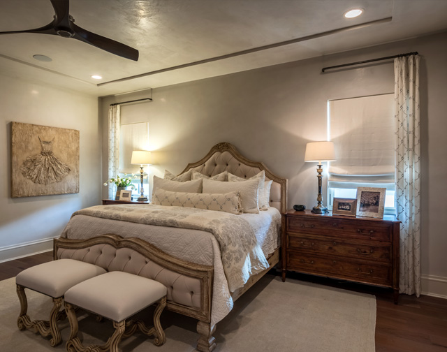 Master bedroom with inset ceiling and iron windows in Houston, TX.
