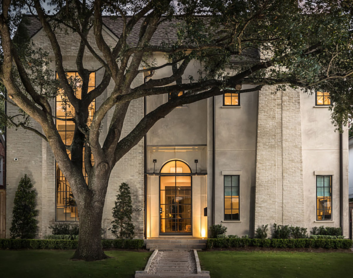 Street view of a custom Home With Iron Windows with curb appeal in Houston, TX.