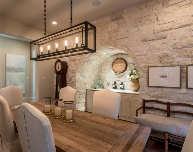 Custom Tuscan style dining room with built-in grotto in Houston, TX.